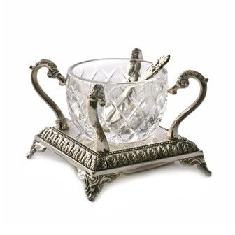 An open single salt cellar including stand and spoon